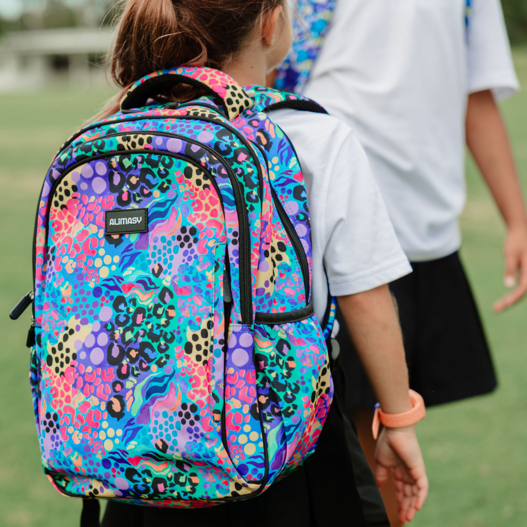 Electric Leopard Midsize Kids Backpack lifestyle image child wearing, lightweight waterproof school bag for boys and girls