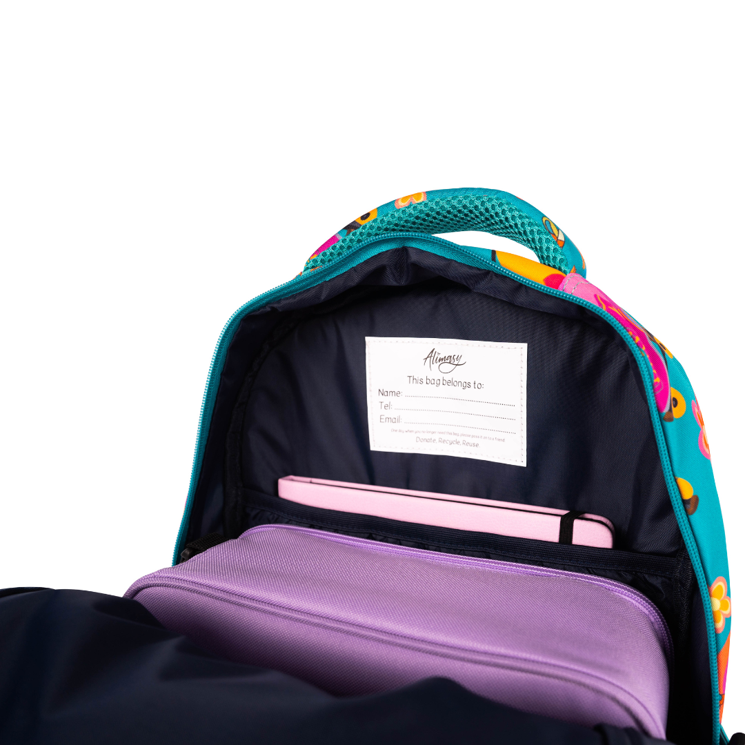 inside of alimasy green roller skates kids backpack with purple lunchbox and pink notebook
