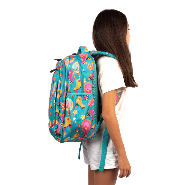 side view of girl wearing alimasy green roller skates large school backpack australia 